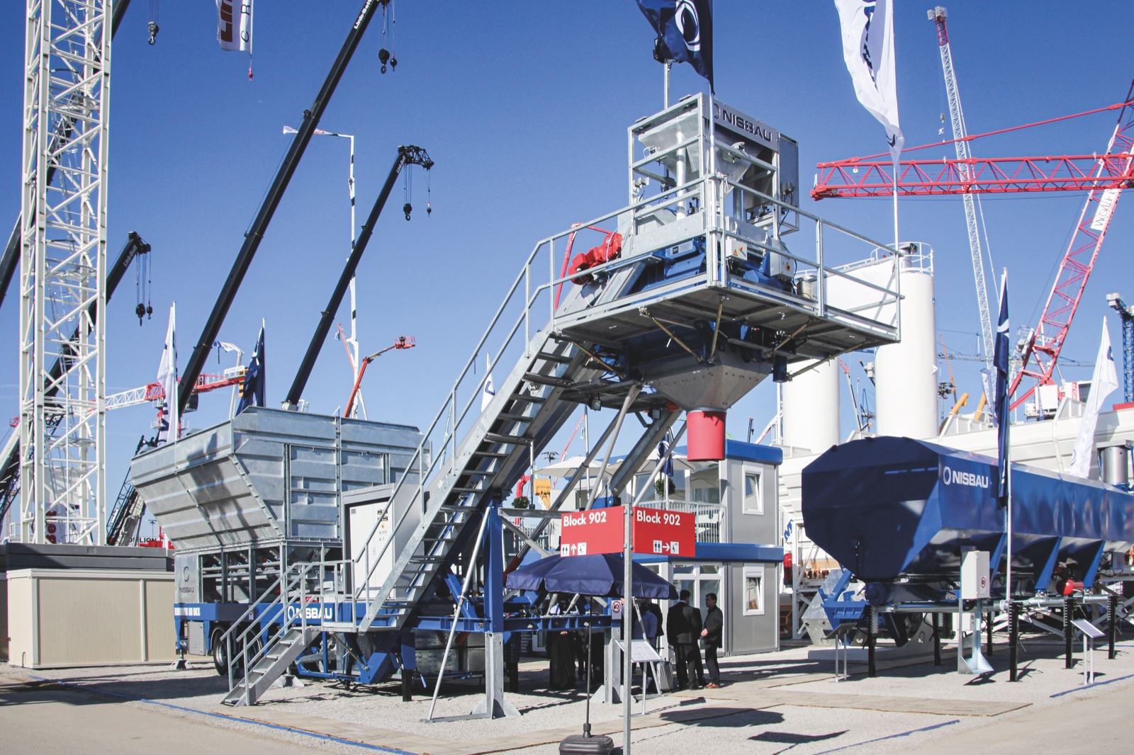 A NISBAU EUROMIX 60 wheel-mobile mixing plant on show at a trade exhibition