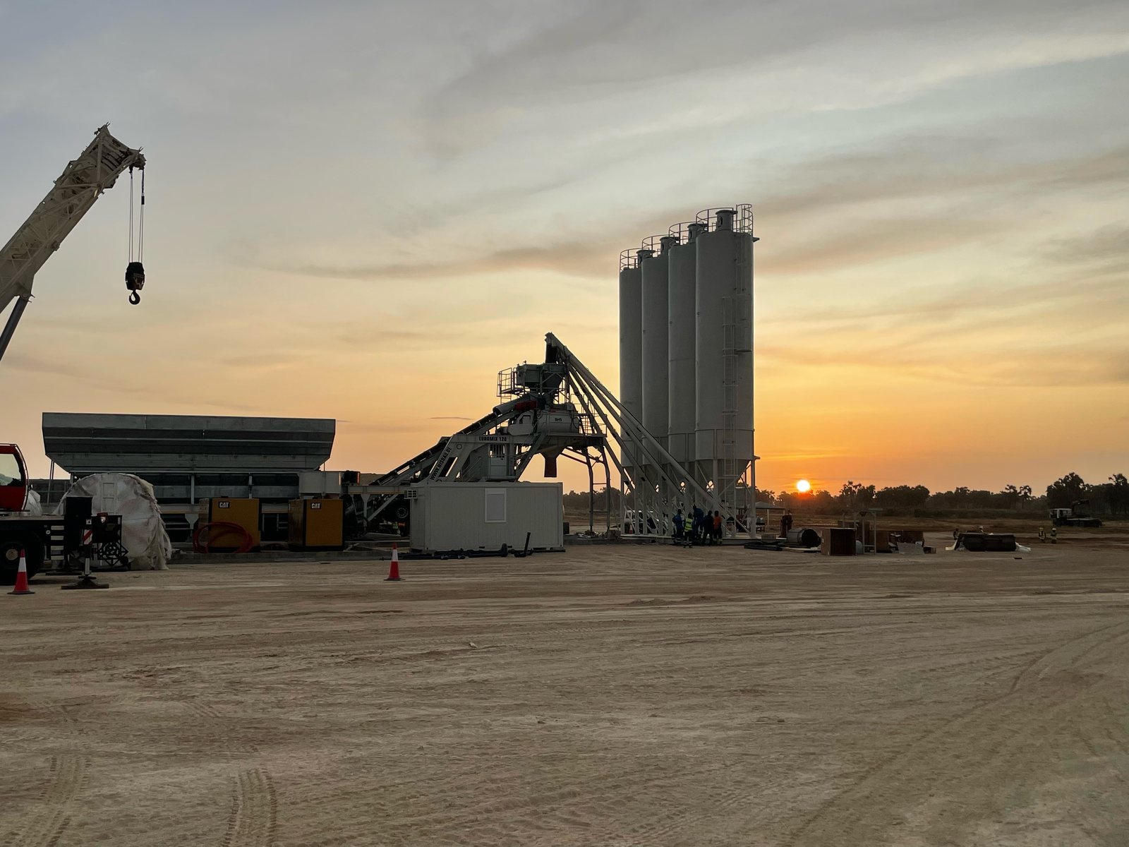 A NISBAU EUROMIX 120 wheel-mobile plant at sunset in Angola