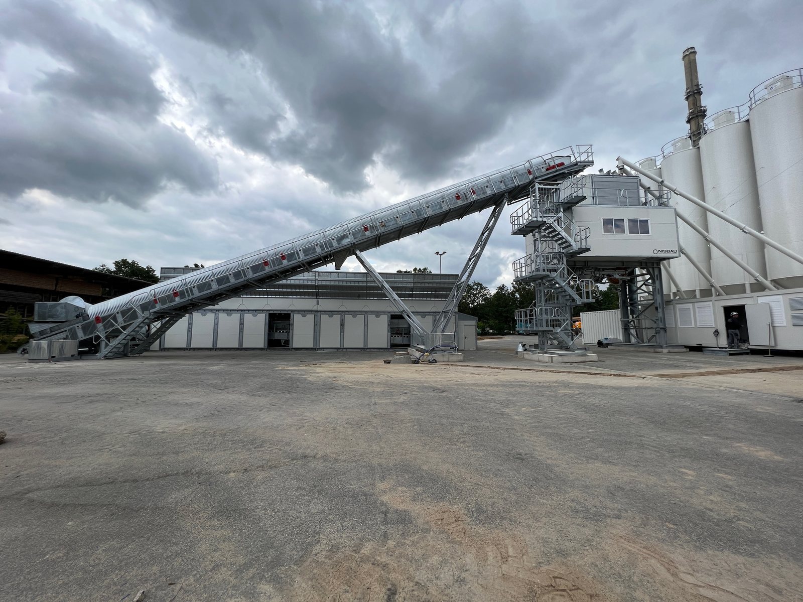 A NISBAU Performance plant under a dramatic sky